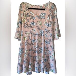 Esley pink floral a-line dress has 3/4 flared sleeves and a rounded v-neck